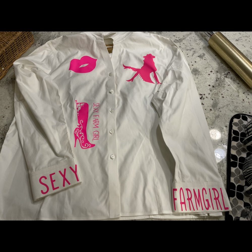 An adorable ladies blouse. It has been embellished with heat transfer vinyl.